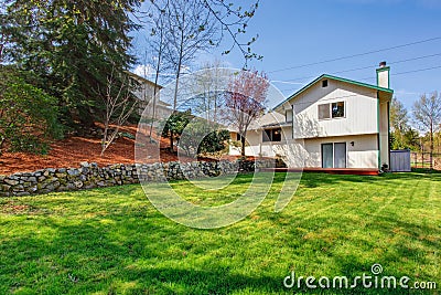 House backyard view. Wooden floor walkout deck