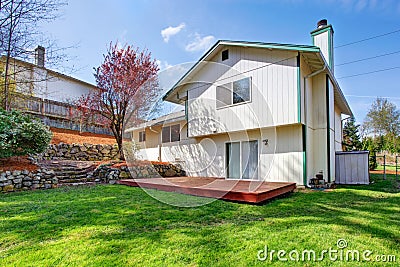 House backyard view. Wooden floor walkout deck