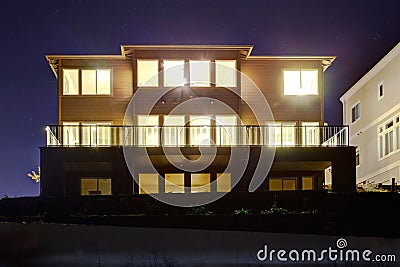 House with lights on. NIght view