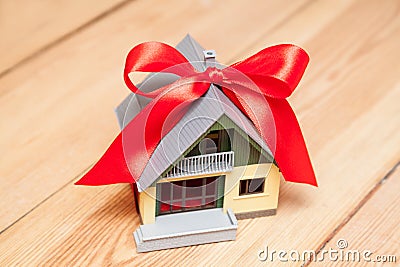 House with red ribbon