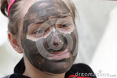 Housewife with mud mask