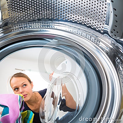 Housework: young woman doing laundry