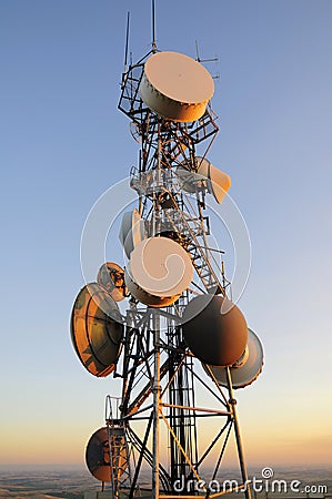 Huge cell phone satellite tower at sunset