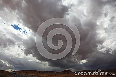 A huge dark cloud on the road