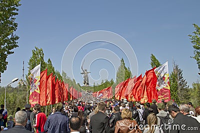 Huge number of people rises up the stairs on the Mamayev Kurgan
