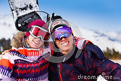 Hugging couple in ski masks together