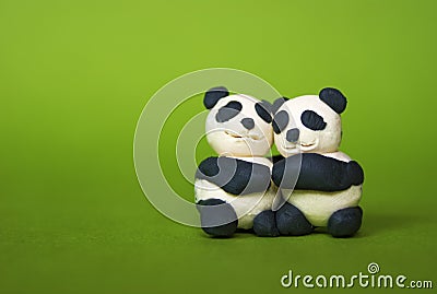 Hugging plasticine pandas