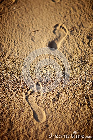 Human footprints on the beach sand