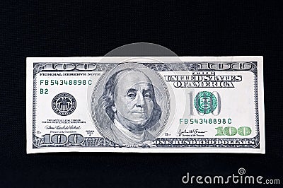 Hundred dollar bill on black
