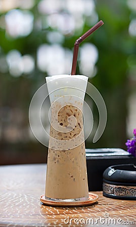 Ice coffee on a wooden table,ice coffee on wood table