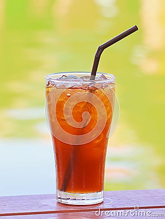 Ice lemon tea on wood table.