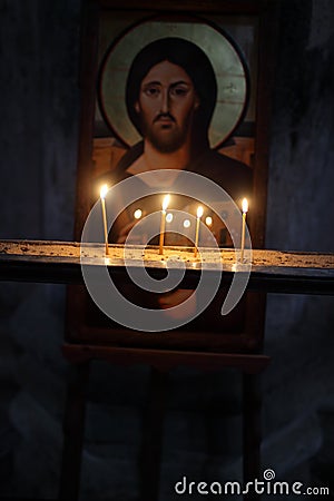 http://thumbs.dreamstime.com/x/icona-di-ges-e-candele-una-chiesa-ortodossa-georgiana-30167044.jpg