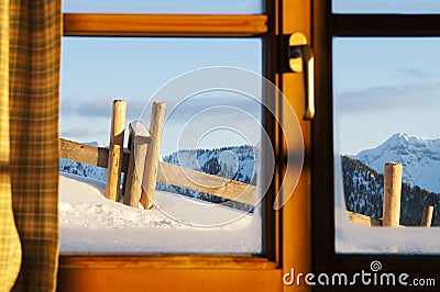 Idyllic view from a chalet to the winter landscape