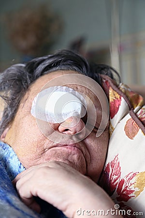 Ill person with eye bandage