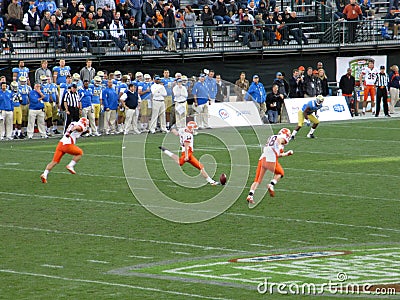 Illinois Kicker kicks football at kickoff