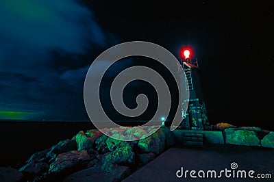 Image of a lighthouse by night