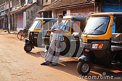 Indian Tuk-Tuk driver waits for customers