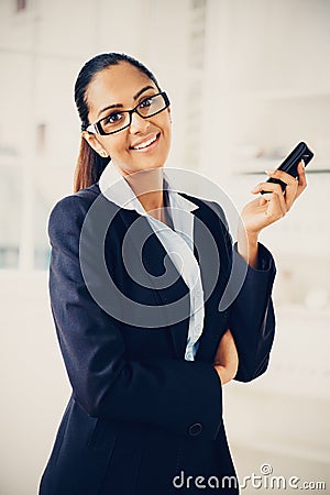 Indian business woman using mobile phone happy