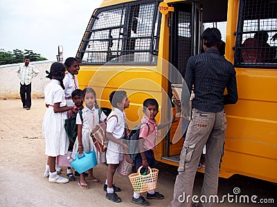 Indian children getting on school bus