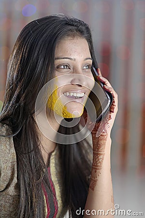 Indian Hindu Bride with turmeric paste on face.