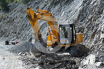 Indian man excavator operator, works at road construction