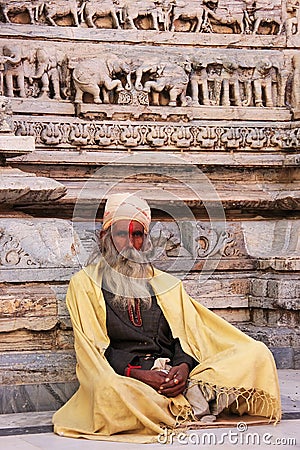 Indian man sitting at Jagdish temple, Udaipur, India