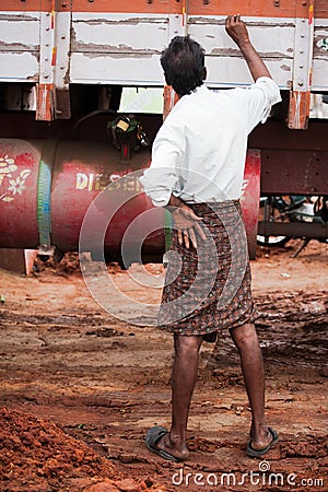 Indian man truck driver in traditional south indian clothes