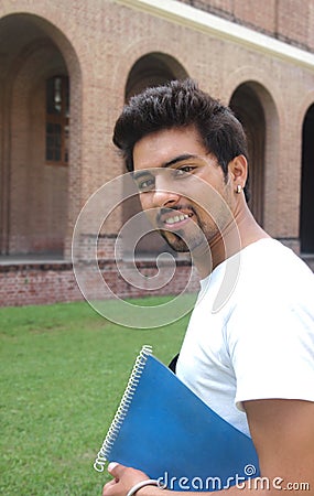 Indian student holding a book.