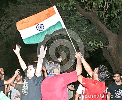 Indians celebrating cricket match victory.