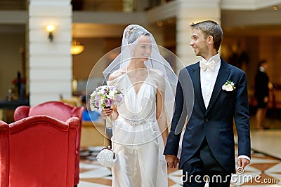 Indoor portrait of a beautiful bride and groom