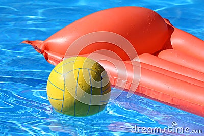 Inflatable mattress and ball in pool