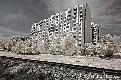 Infrared photo- tree, building and train track