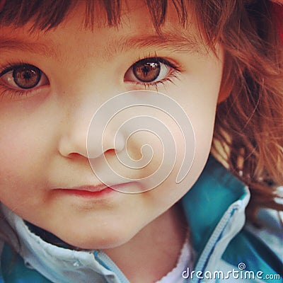 Instagram closeup up of little girl with stunning brown eyes