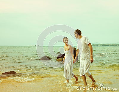 Instagram colorized vintage couple on beach portrait