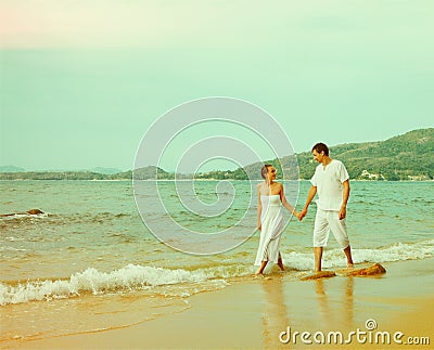 Instagram colorized vintage couple on beach portrait