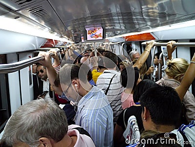 Interior of crowded subway in Rome