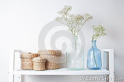 Interior decoration: branches in bottles and baskets