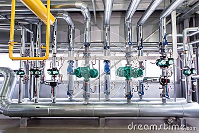 Interior of an industrial boiler, the piping, pumps and motors