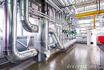 Interior of an industrial boiler, the piping, pumps and motors