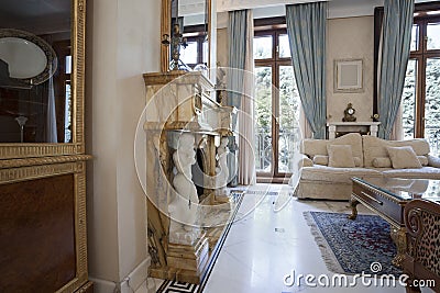 Interior of a living room with fireplace in luxury villa