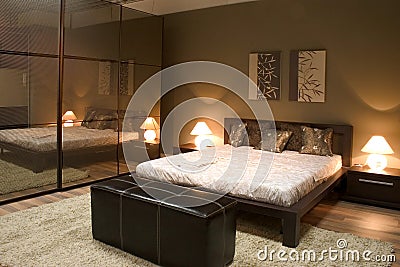 Interior of modern bedroom with mirrors