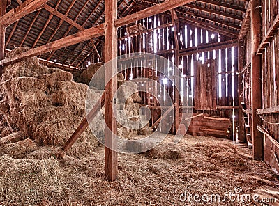 Interior of old barn with straw bales