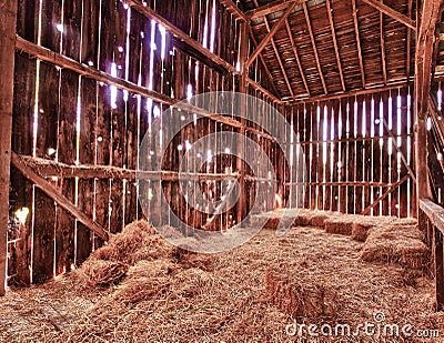 Interior of old barn with straw bales