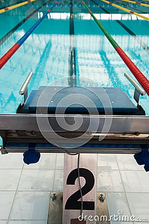 Interior of public indoor swimming pool with racing Lanes and bl