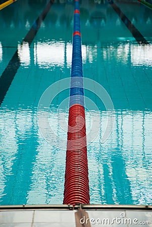 Interior of public indoor swimming pool with racing Lanes and bl