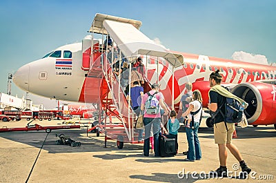 International tourist people boarding Airasia flight in Bangkok airport