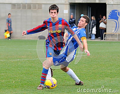Isaac Cuenca (left), F.C. Barcelona youth team player, in action against RCD Espanyol