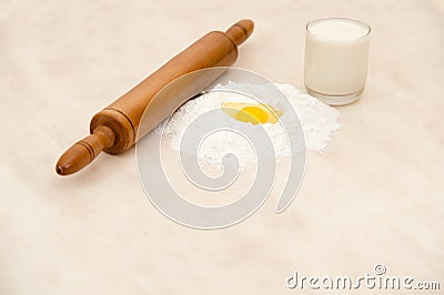 Wooden lawn with wheat flour Egg and milk isolated