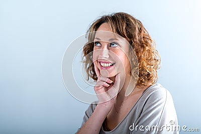 Isolated portrait of a cheerful and happy young woman