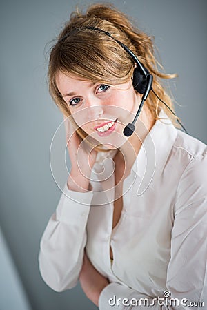 Isolated portrait of cheerful young telephone operator